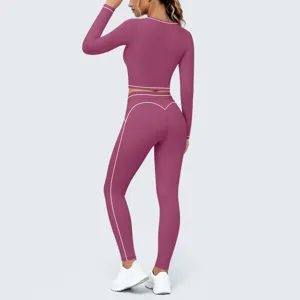 Back detail view of pink long sleeve crop top and high waist fitness yoga leggings set.