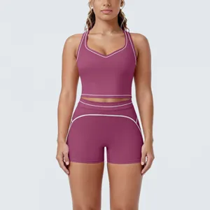 Close-up of contrast piping details on women's athletic crop top and shorts set.