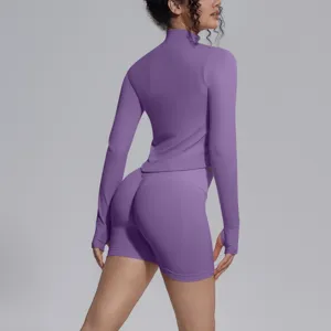 Purple seamless long sleeve crop top and shorts yoga fitness activewear set detail view.