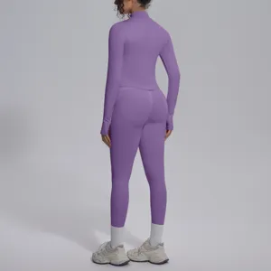 Set yoga sportivo viola senza cuciture con top maniche lunghe e leggings da fitness