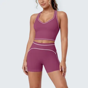 Women's activewear yoga set, maroon sports bra and shorts with white contrast trim for fitness.