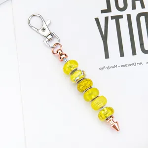 DIY beaded metal keychain with lobster clasp and yellow crystal glass beads for bag charms.