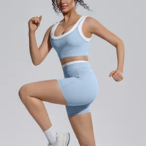 Colorblock two-piece yoga set with sports bra and high-waist fitness shorts for running.