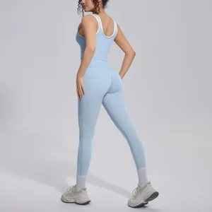 Light blue athletic yoga set, contrast tank top and high waist leggings for running fitness.