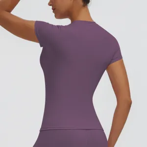 Purple short sleeve sports top detail, slim fit yoga shirt back view, dry fit workout tee.