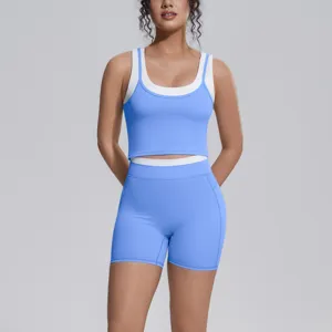 Details of the light blue and white two-piece yoga set, showing breathable activewear fabric.