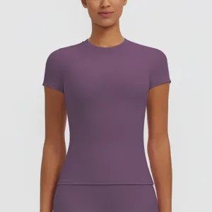 Close-up detail of women's purple short sleeve sports top showing slim fit and fabric.