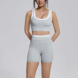 Color-blocking two-piece yoga set with sports bra and high-waisted shorts for fitness running.