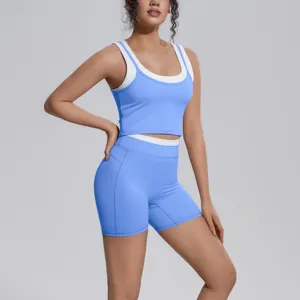 Blue and white colorblock yoga set detail, featuring a supportive tank top and high-waisted shorts.