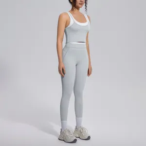 Women activewear set featuring a contrast layered crop top and high waist fitness yoga leggings.