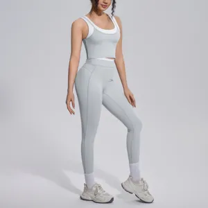 Detailed view of women activewear yoga set with contrast crop top and leggings for fitness.