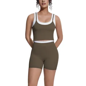 Women contrasting color crop top and shorts yoga set, breathable fitness athletic activewear.