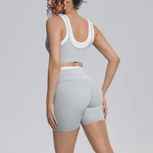 Contrast color seamless yoga set detail, back view of sport bra and high waist fitness shorts.