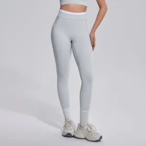 Legging de yoga taille haute avec ceinture contrastée, tissu extensible pour le fitness et le sport.