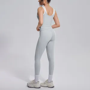 Grey ribbed yoga set detail view showcasing back fit, high waist leggings and breathable fabric.