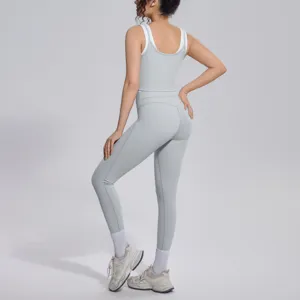 Detailed back view of the light grey yoga set, showing comfortable slim fit and stretchy fabric.