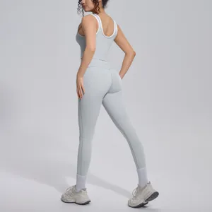 Women's ribbed activewear set, breathable sports bra and high waist yoga leggings for fitness.