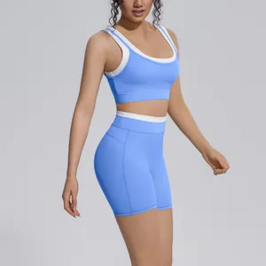 Blue and white two-piece yoga set with sports bra and high waist shorts for fitness running.
