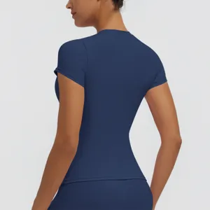 Detail view of dark blue short sleeve dry fit yoga top showcasing back fit and fabric.