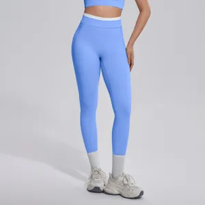 Vue détaillée de pantalon de yoga taille haute bicolore, legging de sport fitness pour femme.