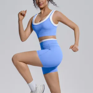 Color-blocked double-sided nylon sports bra and biker shorts activewear set for running.