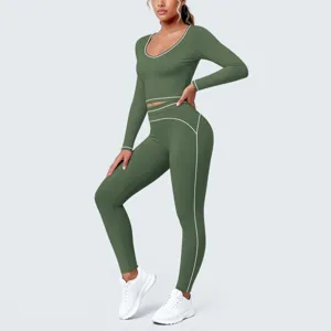 Detailed view of the green contrast piping long sleeve crop top and tight yoga pants set.