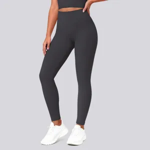 Detailed shot of high-waist yoga pants in dark grey, showcasing fitting shape and stretch fabric.