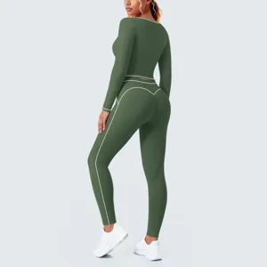 Detail view of dark green athletic yoga set with contrast white piping and workout leggings.