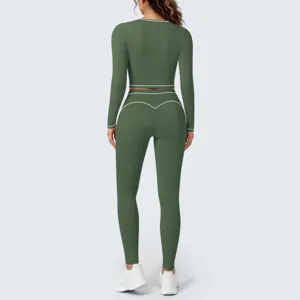 Green long sleeve yoga crop top and high waist leggings set with contrast white piping.