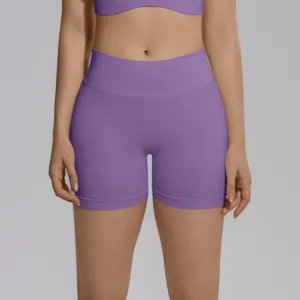 Detail view of high-waisted seamless purple yoga shorts, peach lift fitness activewear.