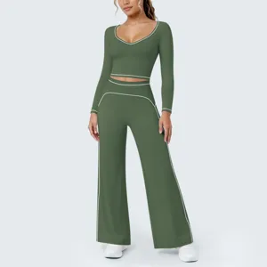 Kontrastfarbenes Langarm Crop Top und weite Yoga Hosen Set für Fitness und Sport.