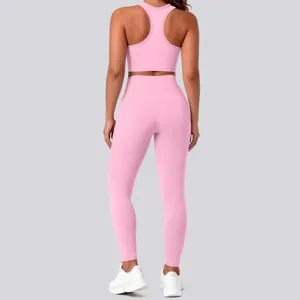 Women pink seamless yoga set high waist fitness leggings and backless sports bra detail view.