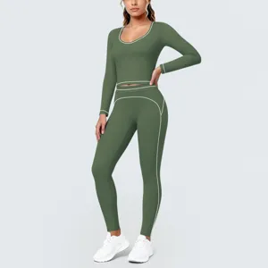 Close-up detail of green long sleeve activewear crop top and high-waist yoga leggings set.