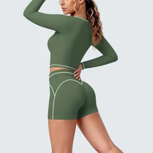 Long sleeve crop top and shorts yoga set featuring stylish white contrast piping details.