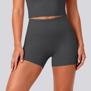 Close-up detail of high-waisted dark gray yoga shorts, stretch athletic activewear.
