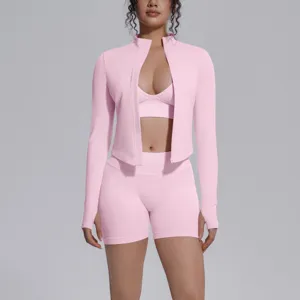 Seamless pink 3-piece activewear set featuring a zip jacket, sports bra, and shorts.