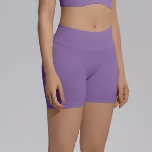 Seamless knit high-waist yoga shorts detail, stretchy purple athletic fitness shorts for women.