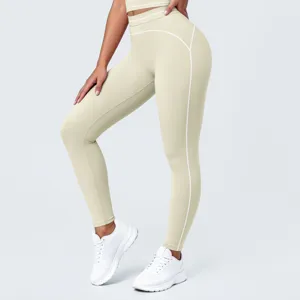 Pantalones de yoga de cintura alta con costuras en contraste, mallas deportivas transpirables.