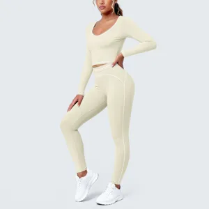 Detailed view of the seamless long-sleeve yoga crop top and matching leggings with contrast trim.