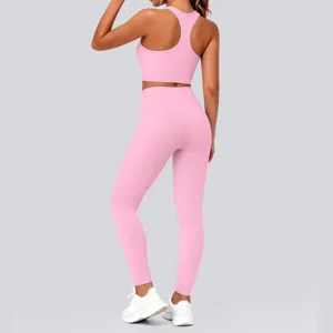 Detail view of the pink racerback sports bra and high-waisted yoga leggings activewear set.