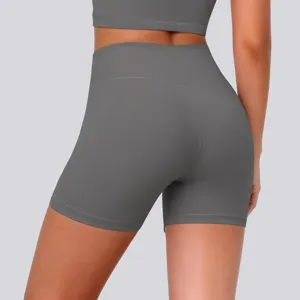 High-waisted athletic yoga shorts in solid grey for gym workouts and daily running. Back view detail.