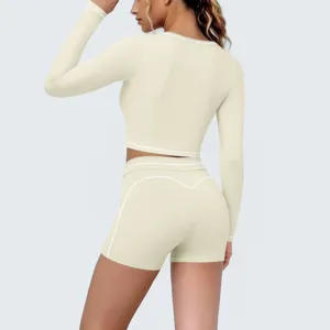 Detail view of the beige long sleeve crop top and shorts yoga set for fitness training.