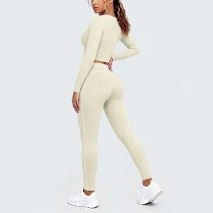 Back view detail of seamless contrast trim long sleeve crop top and yoga leggings set.