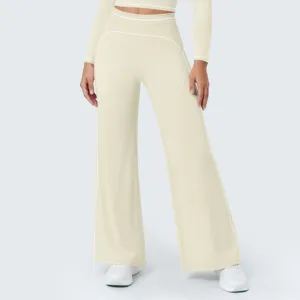 Detail view of high-waist contrast piping wide leg pants and athletic top for workout.