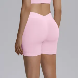 Pink seamless knitted high-waist V-cut peach hip lifting yoga fitness shorts for women.