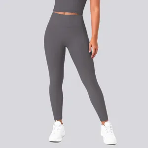 Grey high-waisted yoga pants detail view showing stretchy fabric and slim fit design.