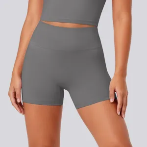 Detail view of high waist tight breathable yoga shorts in grey stretchy fabric for fitness.