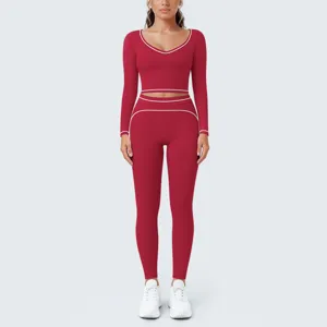 Red long sleeve yoga crop top and leggings fitness workout set contrast piping details.