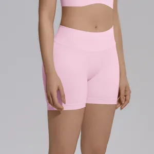 Close-up view of pink high-waist seamless yoga shorts showing fabric texture and fit detail.