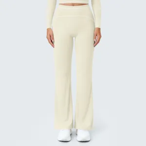 Detail shot of high-waisted flare yoga pants with contrast stitching for women activewear.
